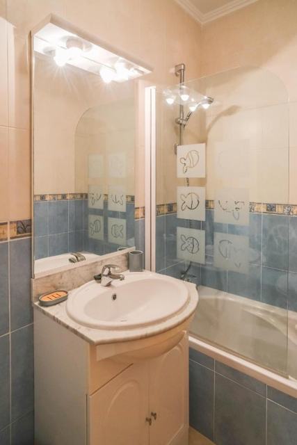 Bathroom with bath and shower
